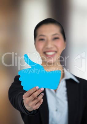 Businesswoman holding thumb up shape