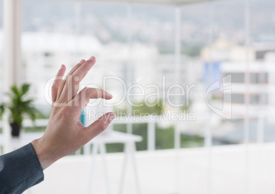 Hand touching  air in office