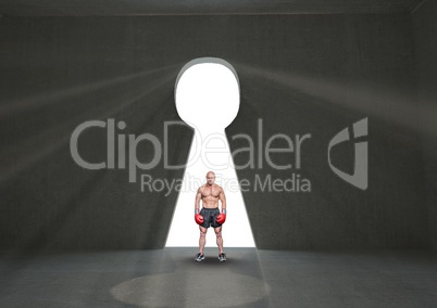 Digital composite image of boxer standing by keyhole
