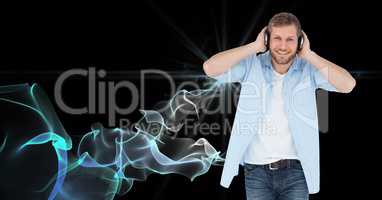 Happy man listening to music on headphones