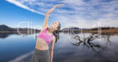 Double exposure of woman performing yoga at lakeshore