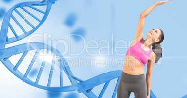 Woman exercising against DNA structure