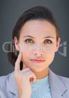 Close up of business woman thinking against grey background