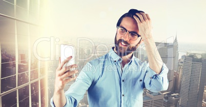 Hipster taking selfie on smart phone