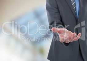Midsection of businessman offering hand