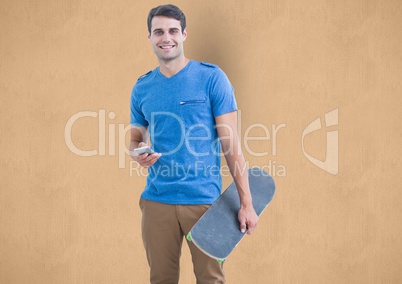 Happy man holding mobile phone and skateboard