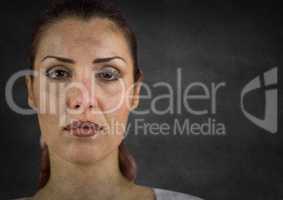 Woman's face after crying against grey wall with grunge overlay