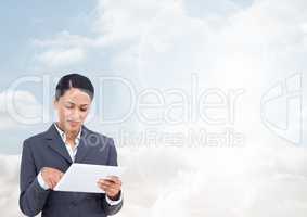 Woman on tablet with bright sky