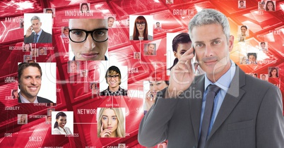 Digitally generated image of businessman using smart phone against portraits