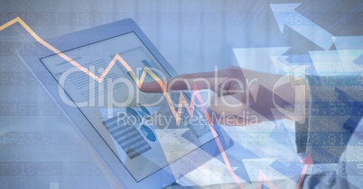 Business person touching digital tablet with graphical overlay