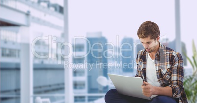 Businessman using laptop outdoors