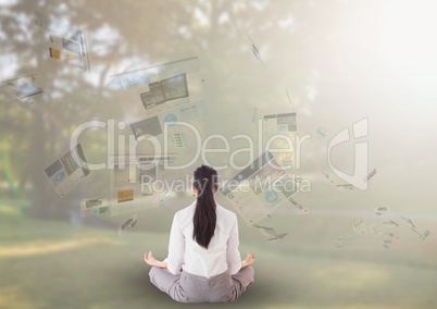 panels with websites flaying and business woman meditating in the park