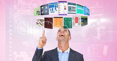 Businessman pointing at panels flying over head