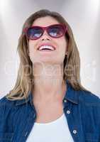 Close up of woman in sunglasses against white background