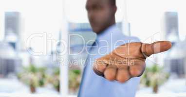 Businessman offering hand in city