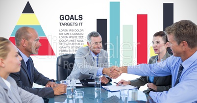 Business people shaking hands against graphs