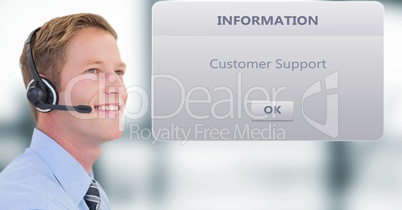 Smiling customer service executive wearing headphones by dialog box
