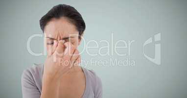 Woman stressed against light blue background