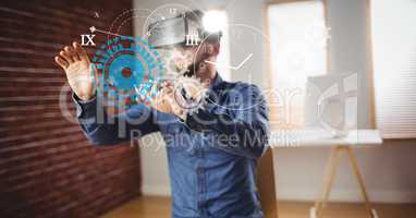 Digital composite image of businessman using VR glasses