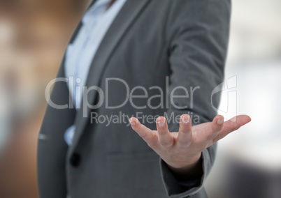 Midsection of businesswoman gesturing in office