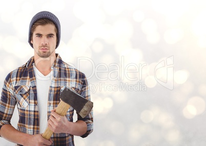 Portrait of confident male hipster holding axe over bokeh