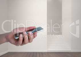 Hand holding a mobile phone and room with steps