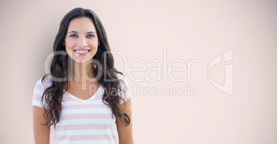 Portrait of happy female hipster standing against pink background