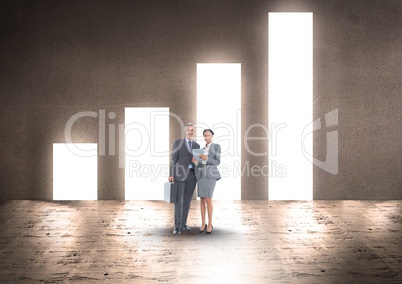 Business people standing against bar graph on wall