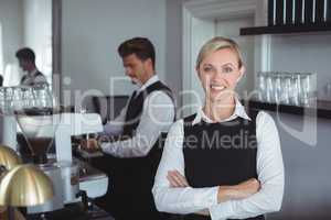 Portrait of waitress smiling at camera