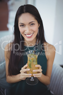 Woman holding cocktail glass