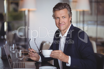 Businessman having coffee in restaurant