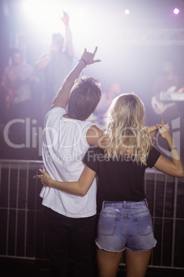 Rear view of couple enjoying at nightclub