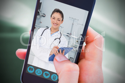 Composite image of woman using her mobile phone