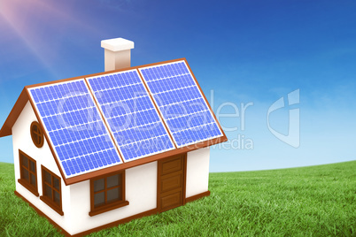 Composite image of digitally generated image of 3d house with solar panels