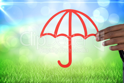 Composite image of hand holding a red umbrella