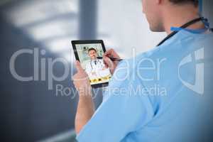 Composite image of surgeon using digital tablet