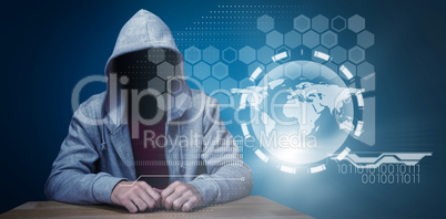 Composite image of robber sitting at table