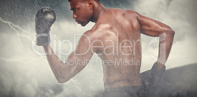 Composite image of muscular boxer