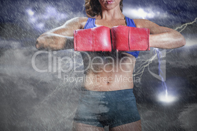 Composite image of midsection of boxer flexing stance