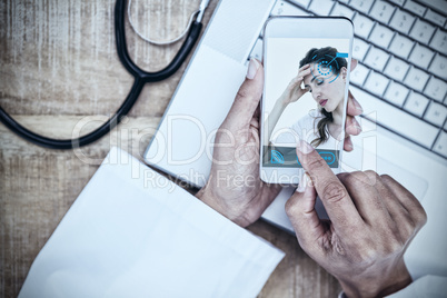 Composite image of brunette suffering from headache