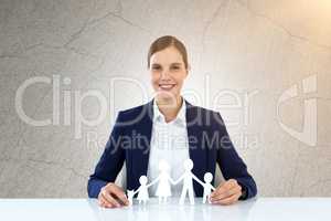 Composite image of family in white paper with a woman in the background