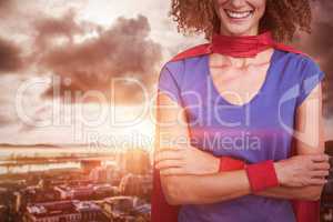 Composite image of portrait of a woman pretending to be superhero