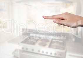 Hand pointing in  air of kitchen