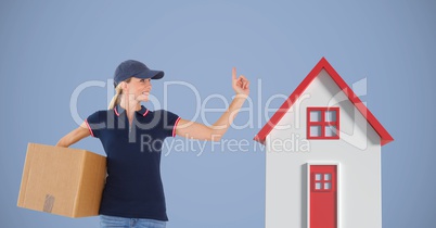 Delivery woman carrying parcel by 3d house