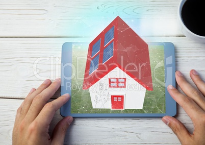 red roof house on tablet. with table