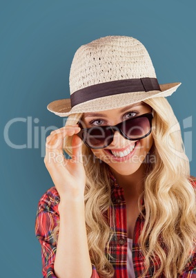 Portrait of happy female hipster wearing sunglasses and sun hat