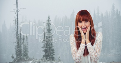 Female hipster with hands on cheeks screaming against trees in foggy weather