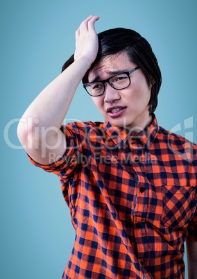 Man stressed against blue background