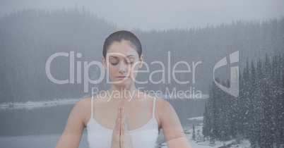 Double exposure of woman meditating in nature