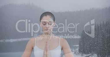 Double exposure of woman meditating in nature